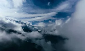 Landscape with mountains and a blue cloudy sky