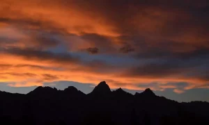 Landscape of mountains with a sunset behind