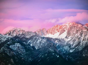 Lanscape with mountains and a violet sky with clouds