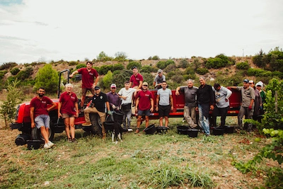Photography of the team from Domaine Clavel alongside the vineyard